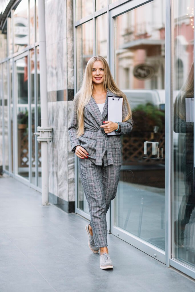 stylish-businesswoman-with-clipboard-city